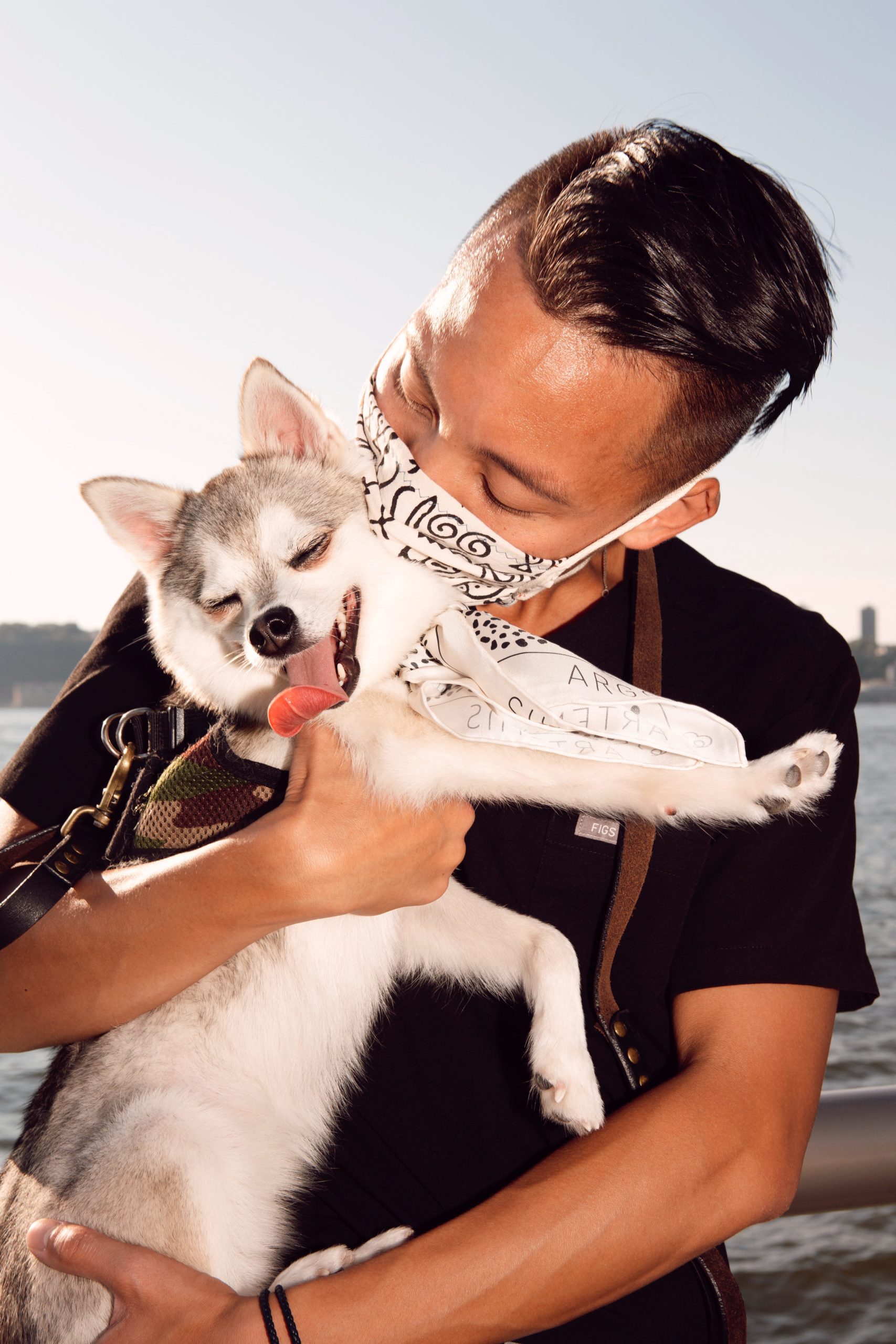 Andy Nguyen, MD, and Dasher the Klee Kai, photographed by Tayler Smith.