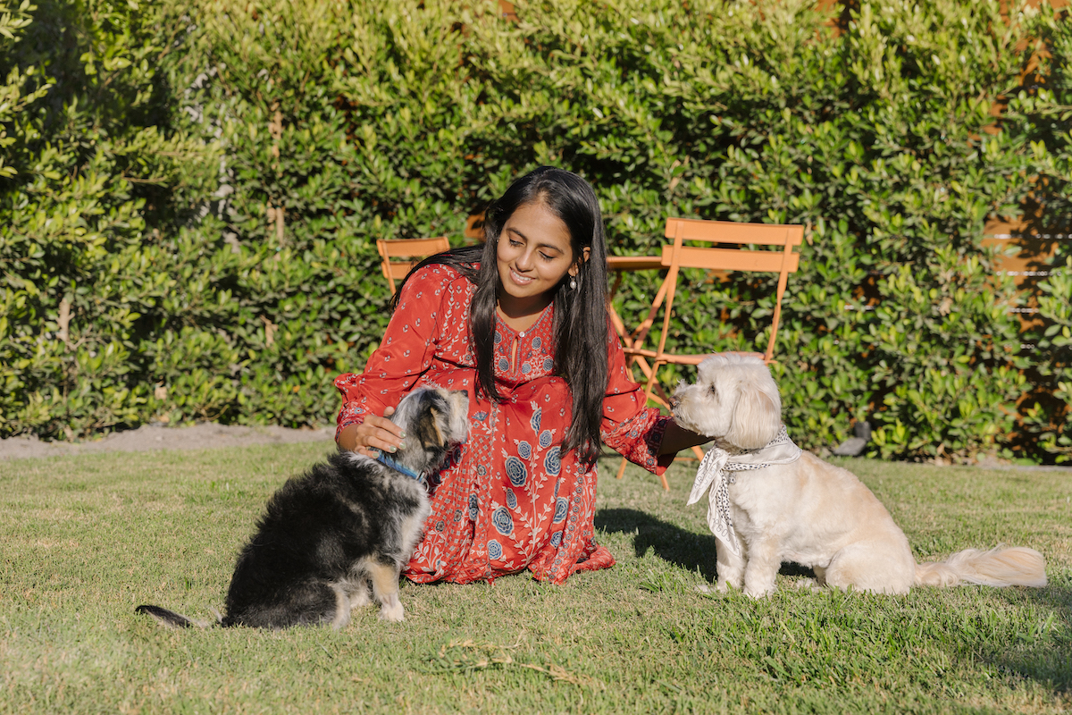 Aishwarya Iyer, Founder & CEO of Brightland, at home with her two dogs, photographed by Hannah Choi for Argos & Artemis.
