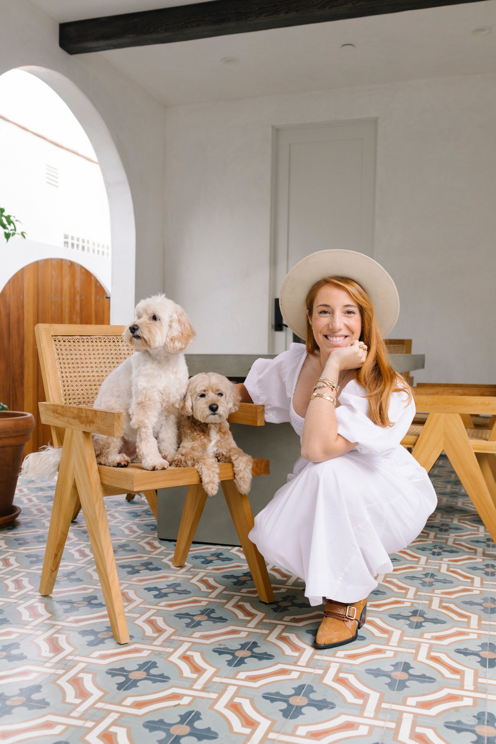 West-Bourne chef and restauranteur Camilla Marcus and her Cockapoo dogs, Teddy and Charlie.