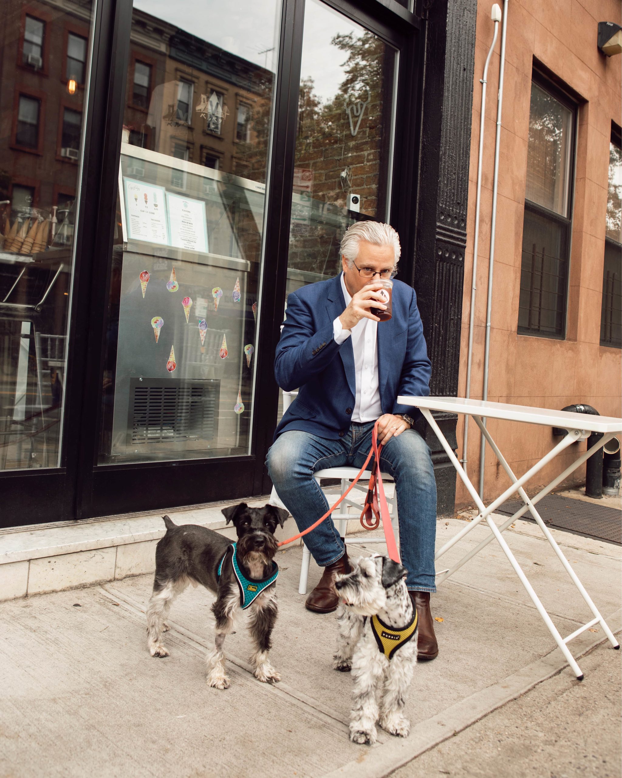 Francie owner John Winterman and his Miniature Schnauzers, Georgie and Cody, outside Velvette Brew in Brooklyn.
